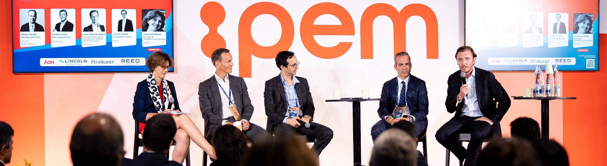 Carlos Candil and fellow panelists on stage under the IPEM sign at IPEM Global 2026 in Paris