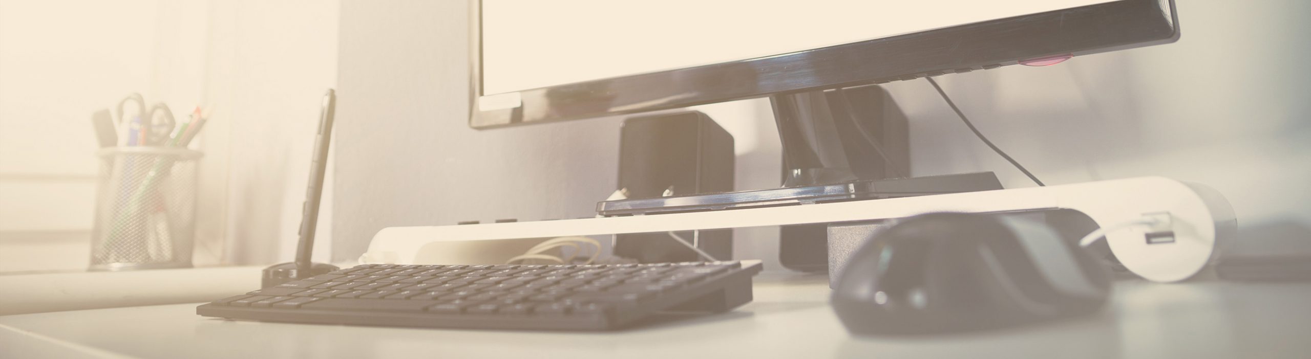 Image displays office desk tech setup